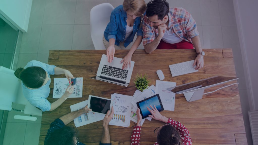 digital marketing agency team working at a table